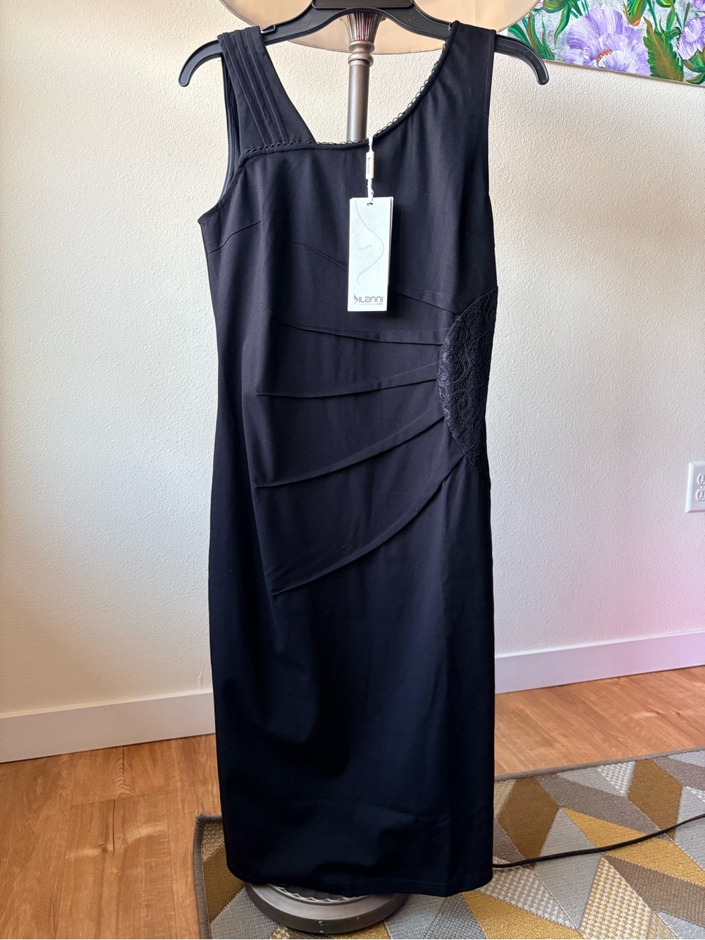 This is an elegant cocktail sheath dress in classic black Silanni.